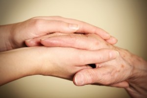 Old-and-young-hands-symbolizing-helping-the-elderly